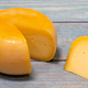 Small wheel of orange cheese